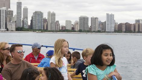 Curious kids enjoy the view on a fun boat trip down the Chicago River with Shoreline Sightseeing