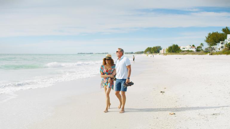 A romantic stroll along the shoreline of one of Bradenton’s Gulf beaches