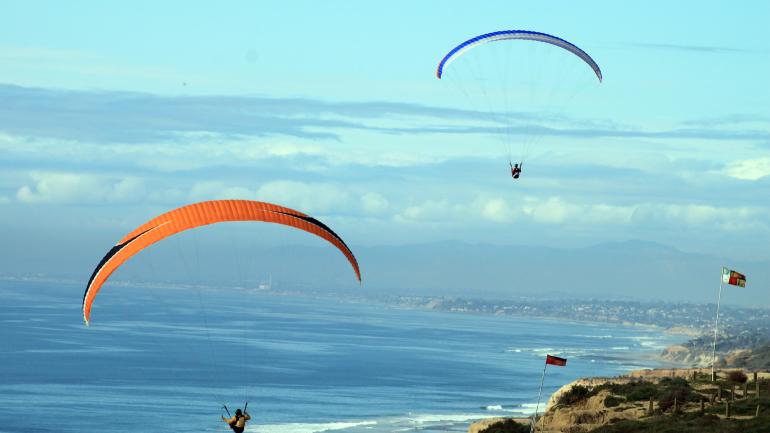 Take to the sky and soar along the coast of San Diego in a paraglider.