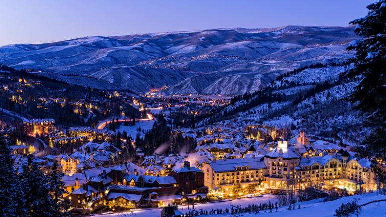 Beaver Creek ski runs and the village illuminated at dusk in Colorado