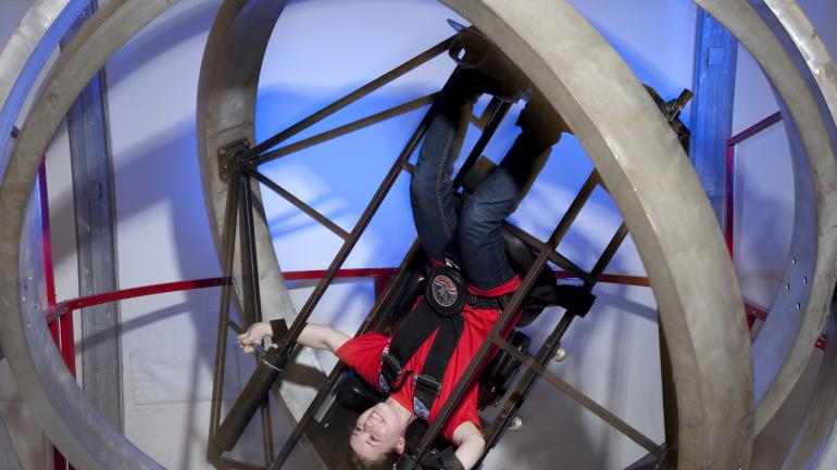 Riding the Multi Axis training simulator, which creates the sensation of what it’s like to tumble through space