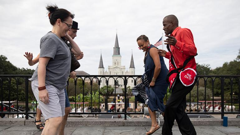 An impromptu dance party with Jackson Square in the background