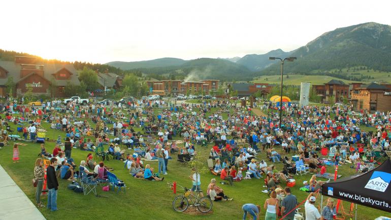 Listening to live music in the mountains in Big Sky