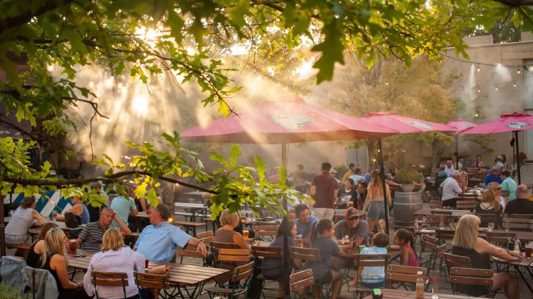The sun-dappled beer garden at Schulz Bräu Brewing Company