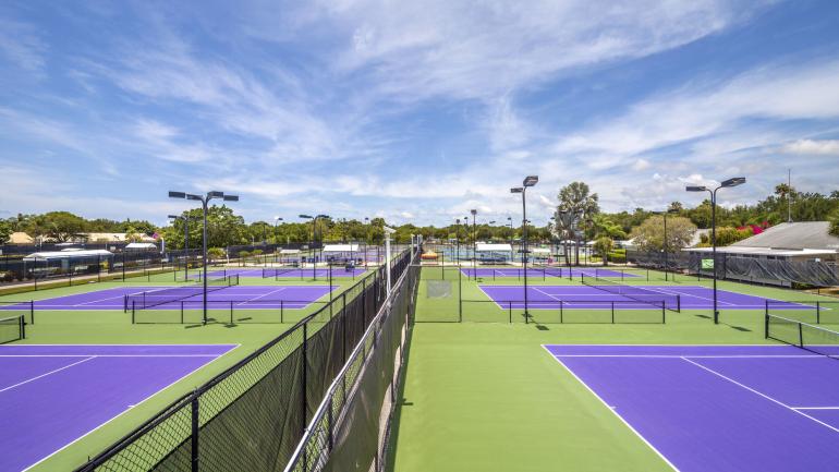 An array of beautifully maintained tennis courts at IMG Academy