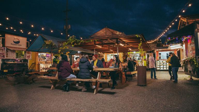 Open-air dining at food cart pod Hawthorne Asylum