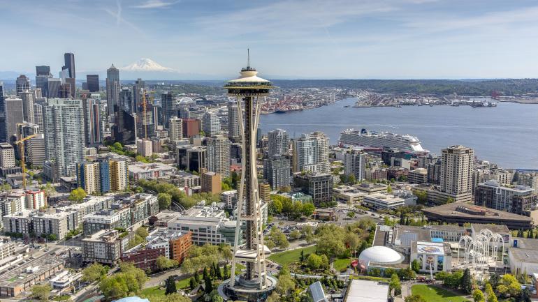 View of downtown Seattle, Washington, featuring the iconic Space Needle and the Port of Seattle