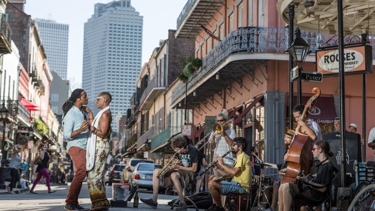 Couple dancing to live music on Royal Street in the French Quarter of New Orleans, Louisiana