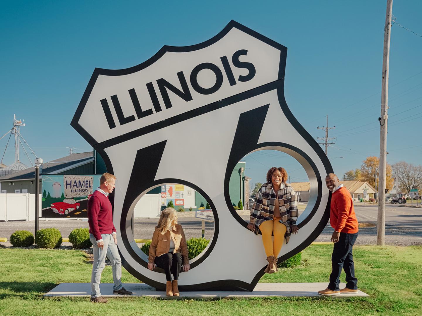 Posing with a sign celebrating Route 66 in Hamel, Illinois Posing with a sign celebrating Route 66 in Hamel, Illinois