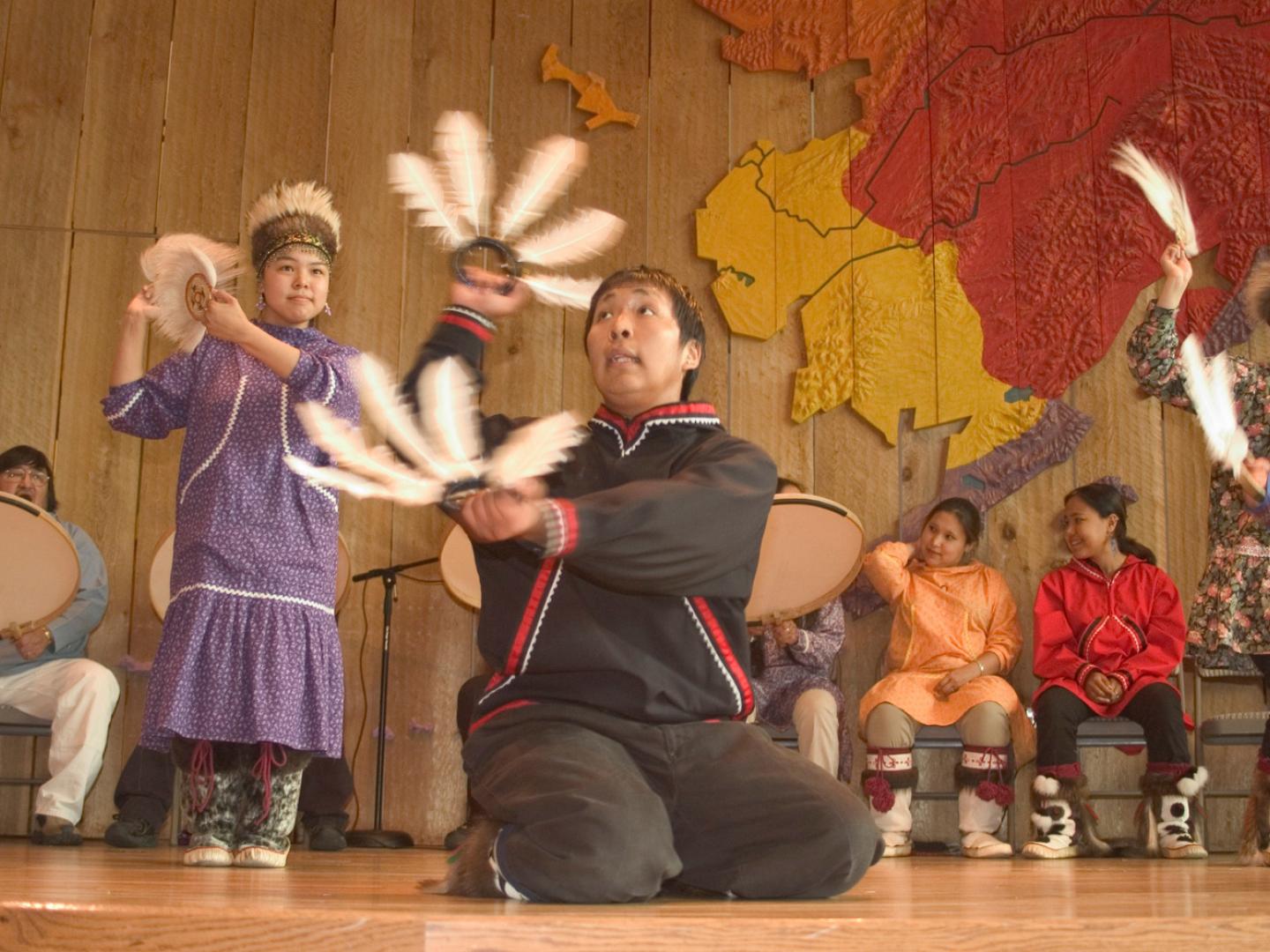 A group dancing during a cultural program at the Alaska Native Heritage Center in Anchorage, Alaska A group dancing during a cultural program at the Alaska Native Heritage Center in Anchorage, Alaska