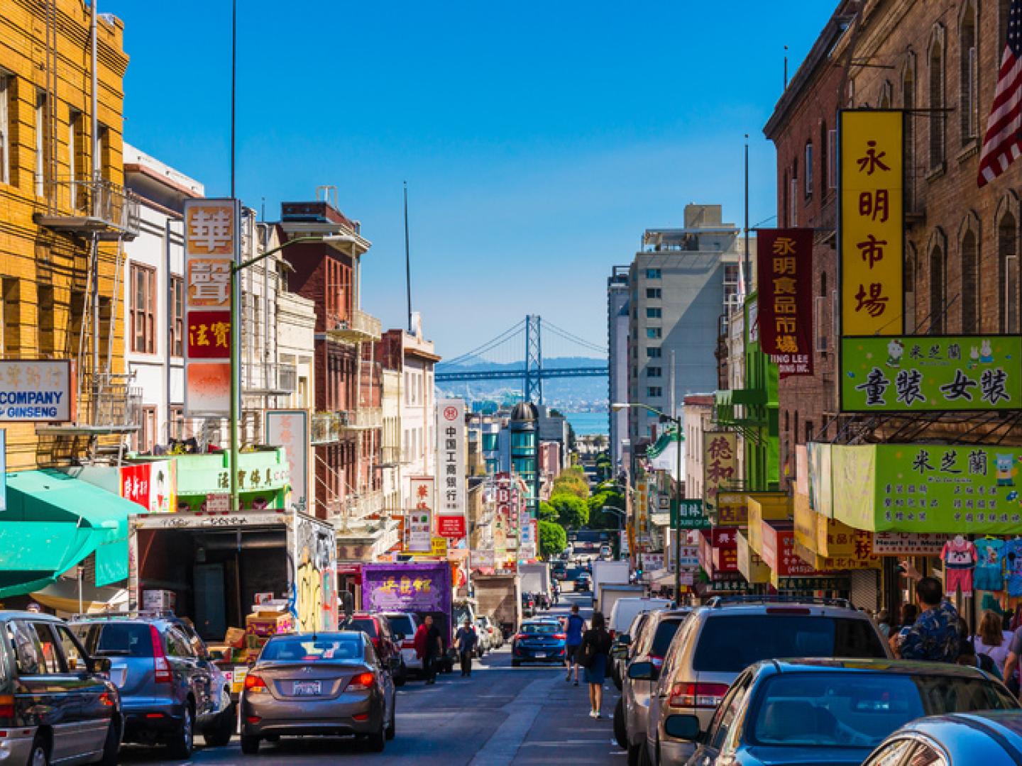 The Bay Bridge visible from the bustling streets of Chinatown in San Francisco, California The Bay Bridge visible from the bustling streets of Chinatown in San Francisco, California