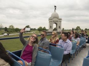 Touring Gettysburg National Military Park in Pennsylvania via open-air bus