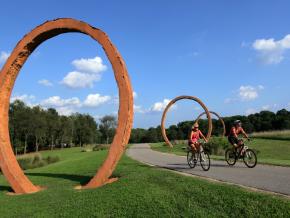 Biking alongside sculptures in the North Carolina Museum of Art’s sprawling Museum Park