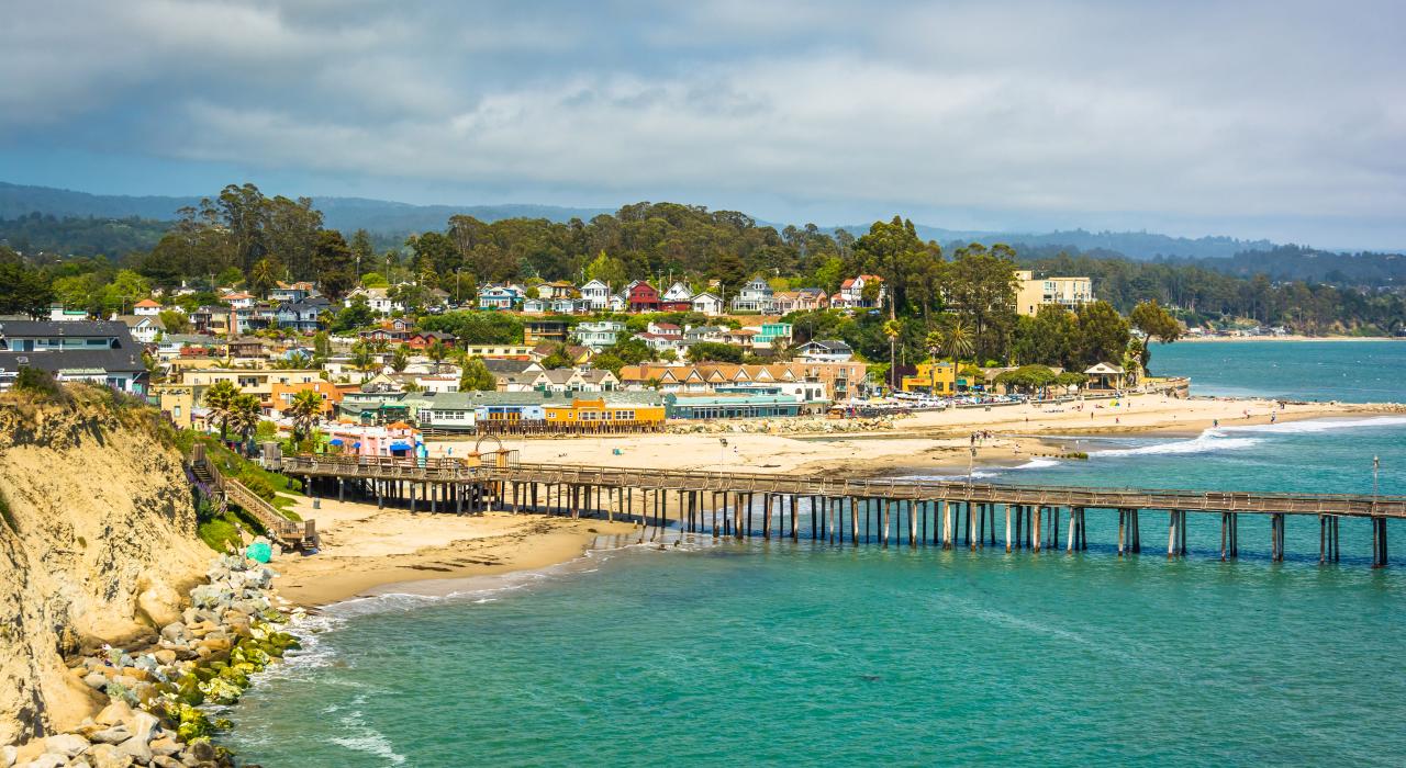 Pier and colorful houses at Capitola Beach