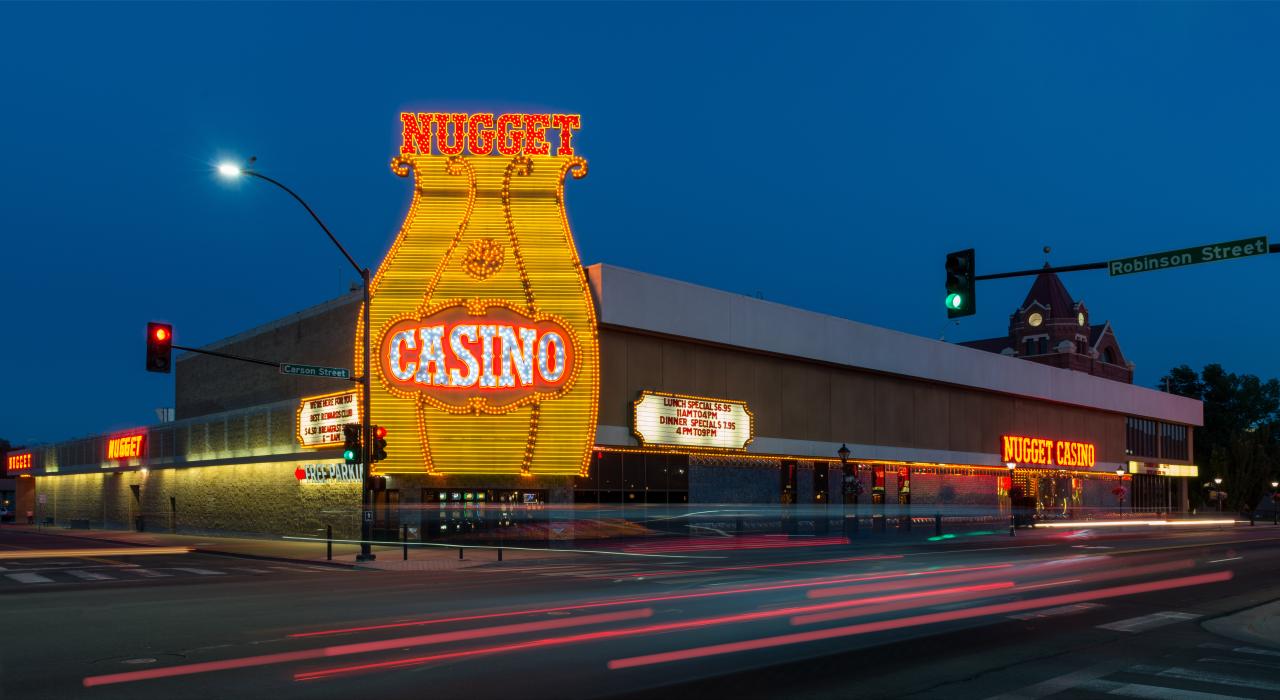 Traffic blurs outside the Carson Nugget hotel and casino