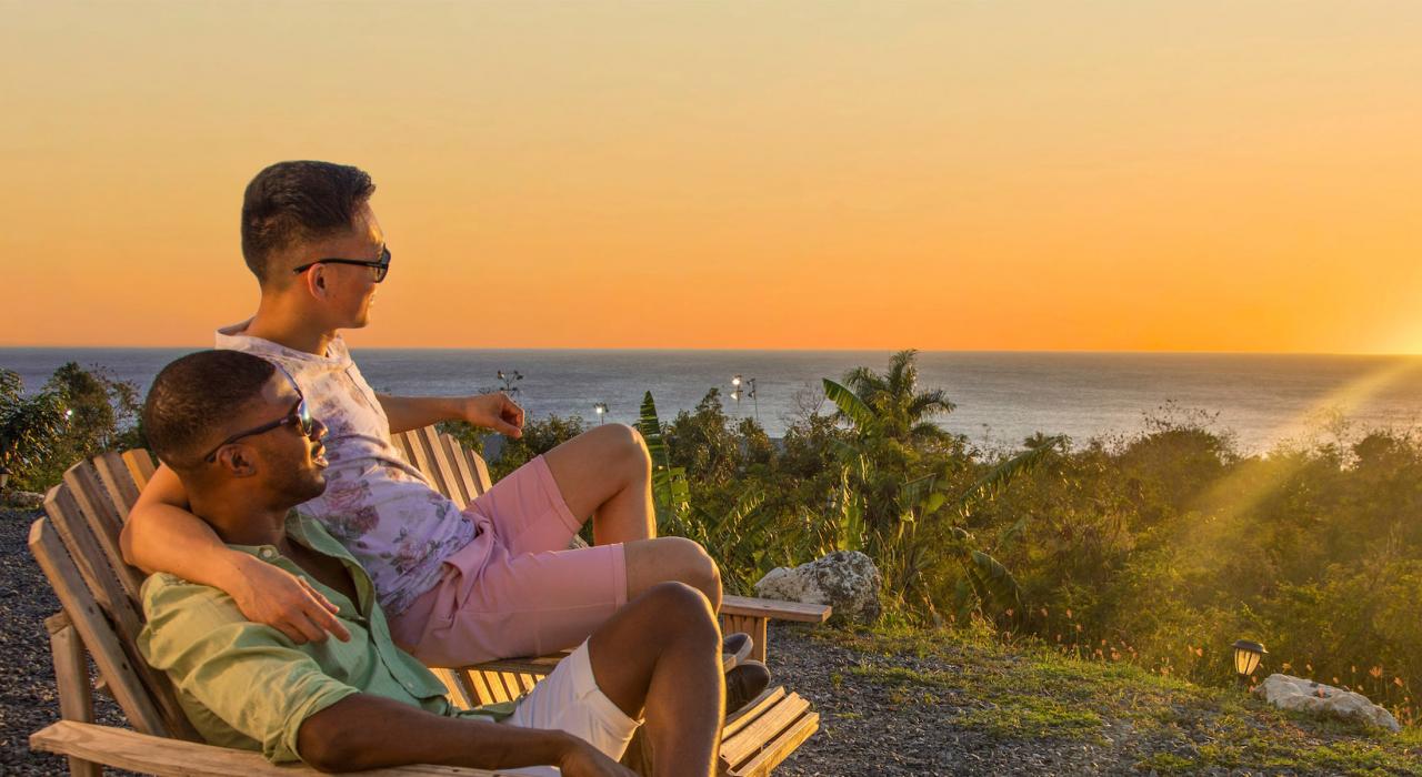 Couple watching the sunset in Rincon, Puerto Rico