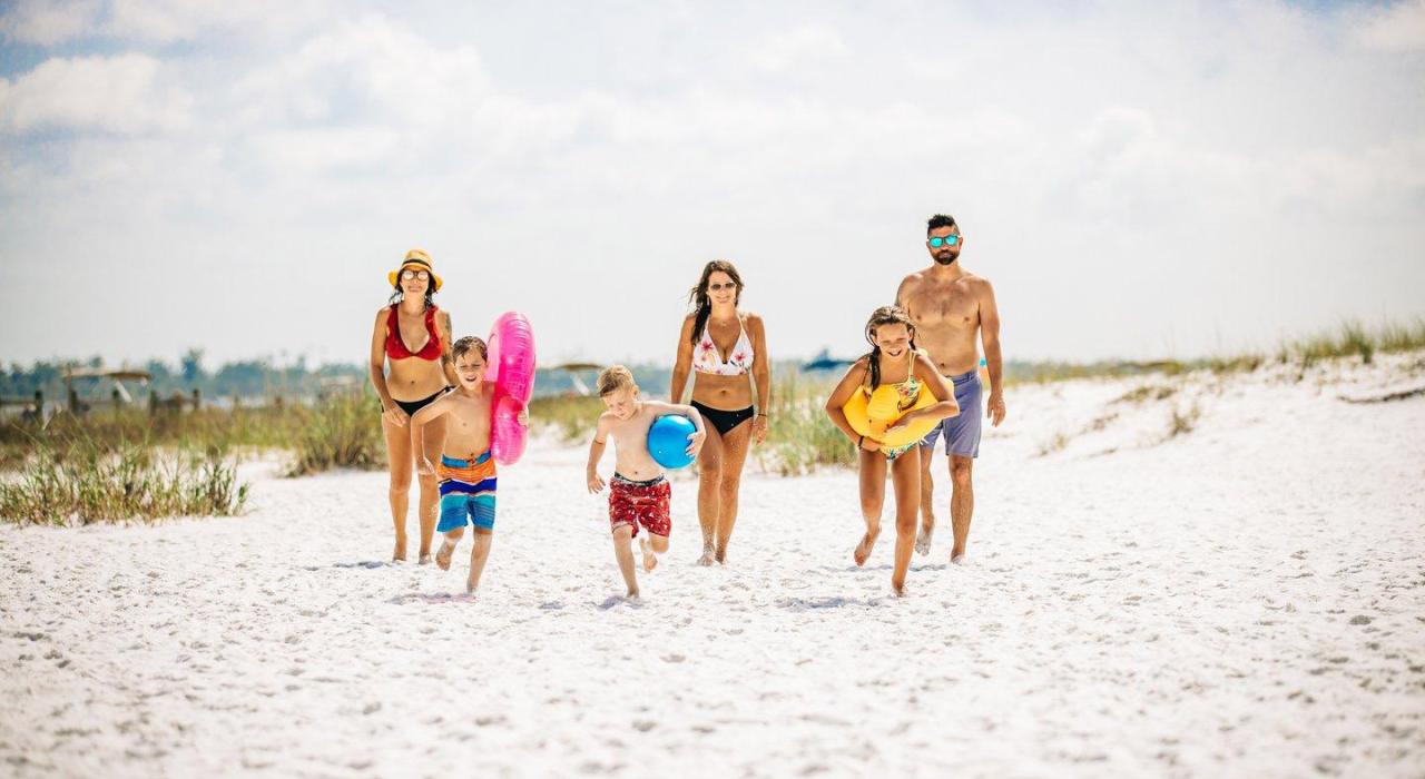 Visitors spending a day of sun and sand of Panama City Beach, Florida